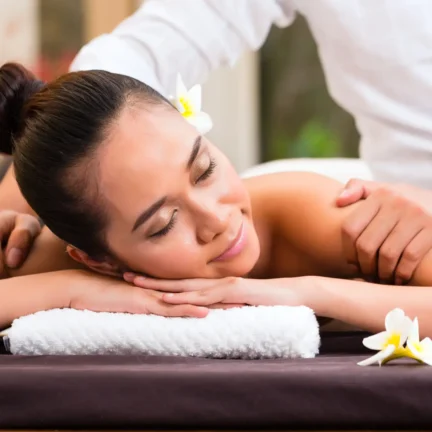Indonesian Asian woman in wellness beauty day spa having aroma therapy massage with essential oil, looking relaxed