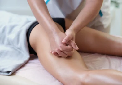 Caucasian woman getting a leg massage in the spa salon. Body care concept. Special anticellulite treatment.