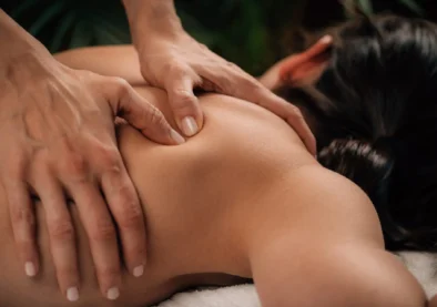 Woman Enjoying Deep Tissue Massage in Salon